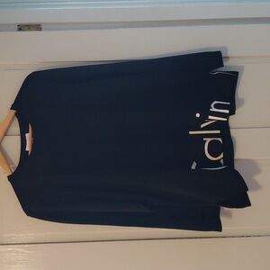 Calvin Klein sweater with black and white reverses name along the bottom